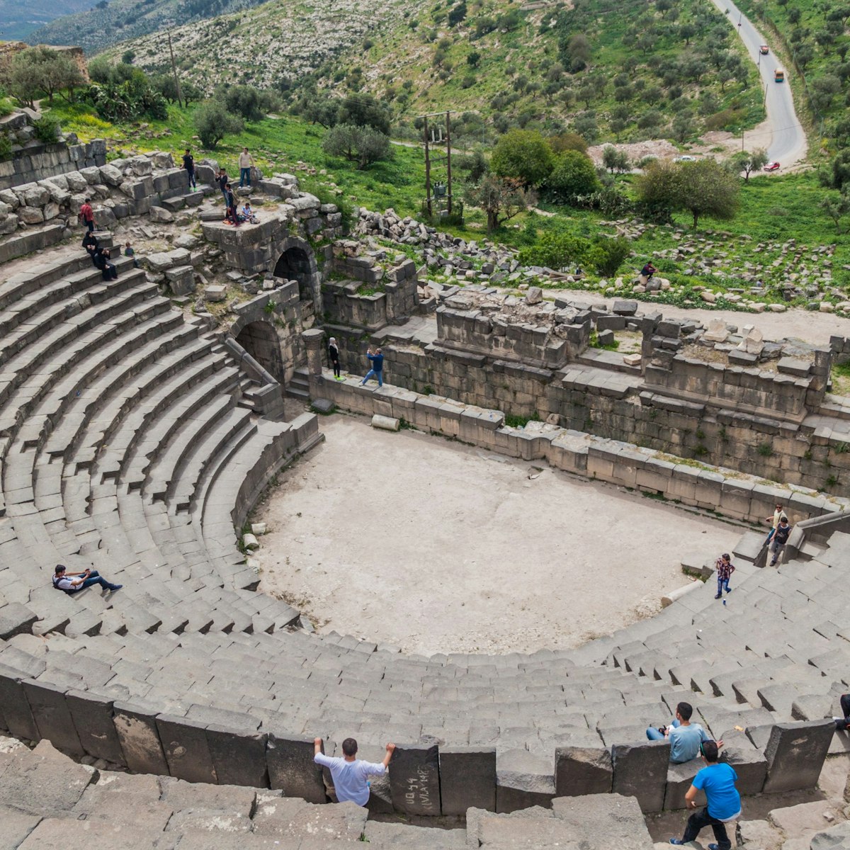 Tourists visit the West Theatre ruins in Umm Qais.