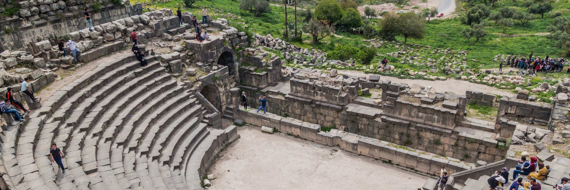 Tourists visit the West Theatre ruins in Umm Qais.