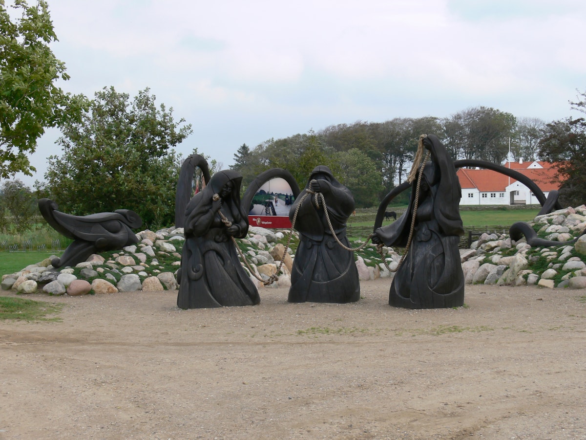 Sculpture of the three norns at the Ribe Vikingecenter.