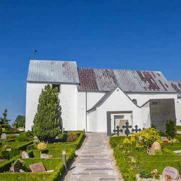 Path leading to the historic church of Jelling, Denmark.