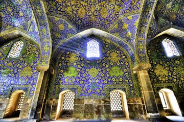Imam Mosque at Naqhsh-e Jahan Square in Isfahan, Iran. Imam mosque is known as Shah Mosque. Its construction finished in 1629.; Shutterstock ID 92388088; Your name (First / Last): Lauren Keith; GL account no.: 65050; Netsuite department name: Online Editorial; Full Product or Project name including edition: Middle East Online Highlights Update
ancient, arch, architecture, art, building, culture, dark, decoration, design, dome, east, esfahan, heritage, historic, holy, imam, inner, inside, interior, iran, iranian, isfahan, islam, islamic, jahan, light, masjid, mosque, muslim, naqsh-e, old, ornament, pattern, persia, persian, pray, religion, sacred, shah, shine, sight, site, square, structure, sunlight, sunny, tile, traditional, vintage, wall