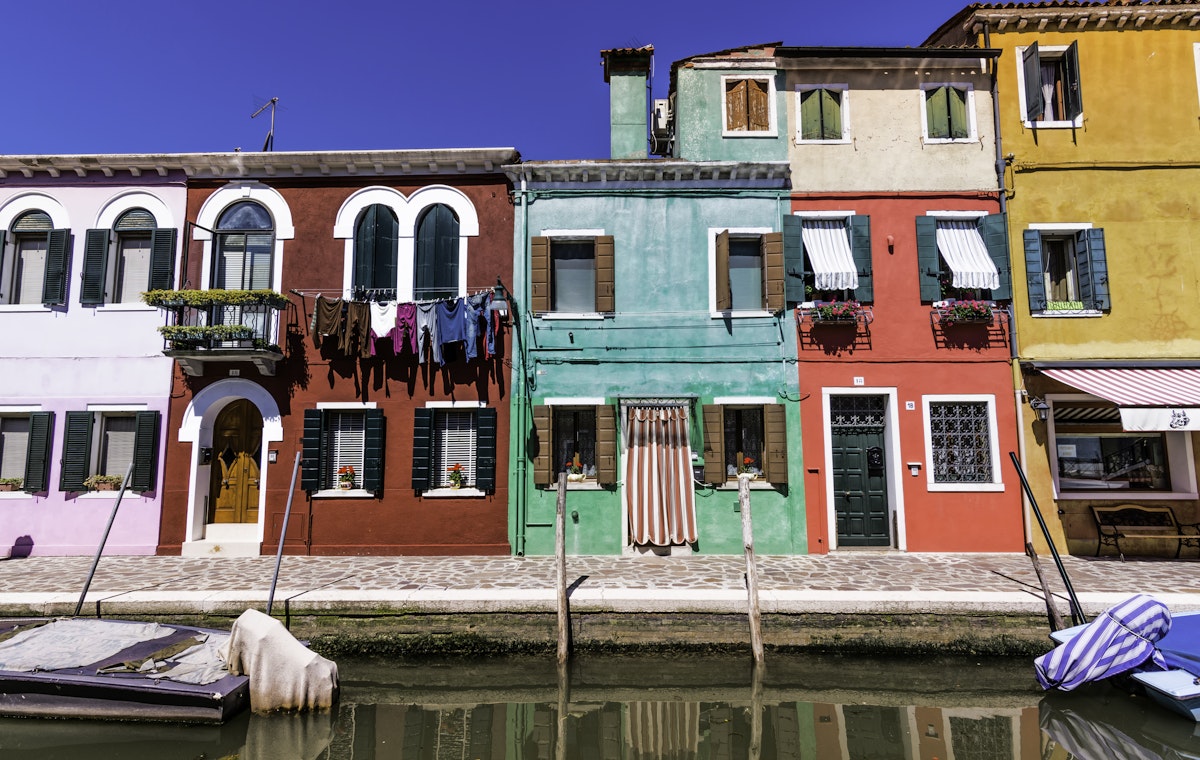 Colourful row houses by canal, Burano.
burano, cityscape, clear, color, europe, home, house, inviting, italia, italy, row, travel, venice, warm