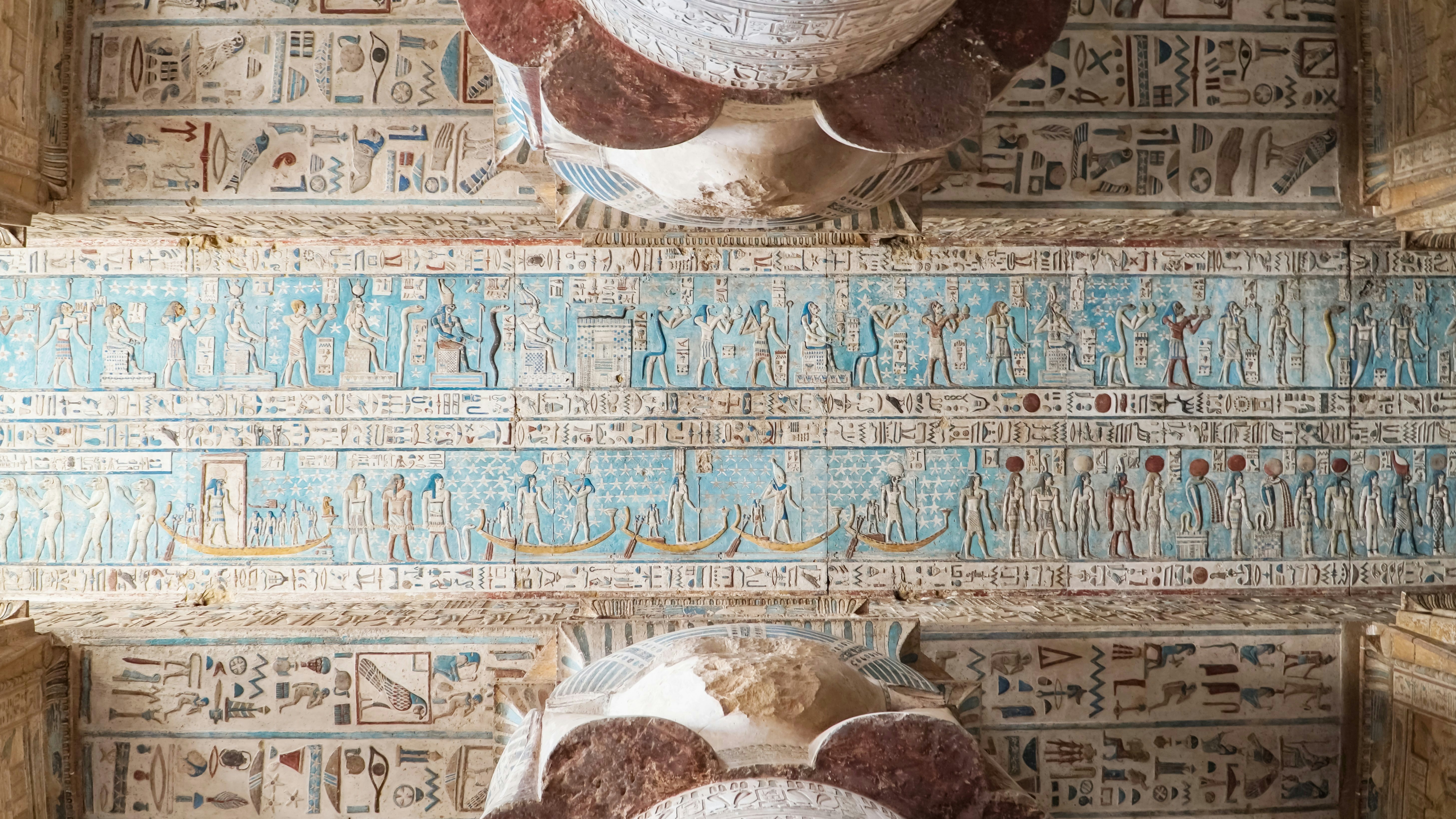 Interior of Dendera temple or Temple of Hathor, Egypt. Dendera , also spelled Denderah, is a small town and former bishopric in Egypt situated on the west bank of the Nile, about 5 kilometres south of Qena, on the opposite side of the river. It is located approximately 60 kilometres north of Luxor. It contains the Dendera Temple complex, one of the best-preserved temple sites from ancient Upper Egypt.