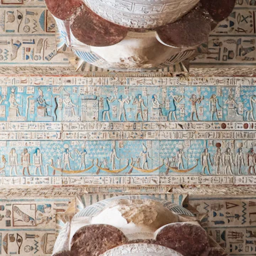 Interior of Dendera temple or Temple of Hathor, Egypt. Dendera , also spelled Denderah, is a small town and former bishopric in Egypt situated on the west bank of the Nile, about 5 kilometres south of Qena, on the opposite side of the river. It is located approximately 60 kilometres north of Luxor. It contains the Dendera Temple complex, one of the best-preserved temple sites from ancient Upper Egypt.