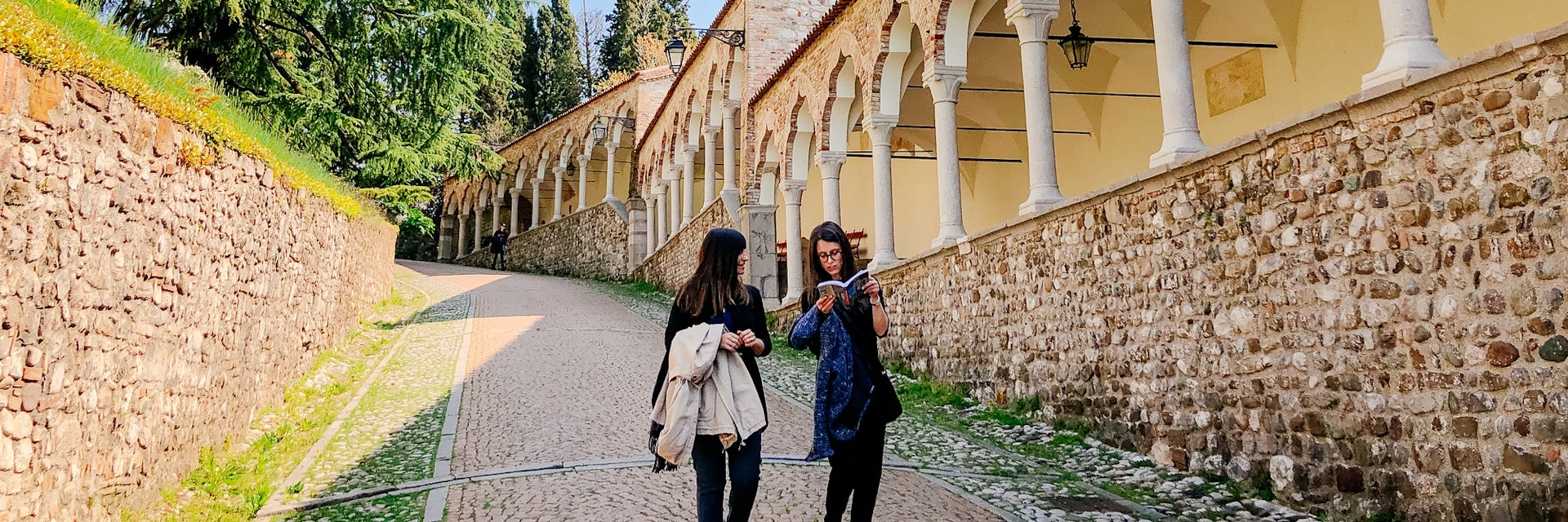 Europe, Italy, Friuli-Venezia-Giulia. Women walking in the patio near the arcades of the Piazzale del Castello in Udine.
1152464159
piazzale