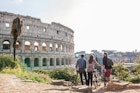 Three happy young friends tourists with bikes at Colosseum in Rome having fun
1162952296