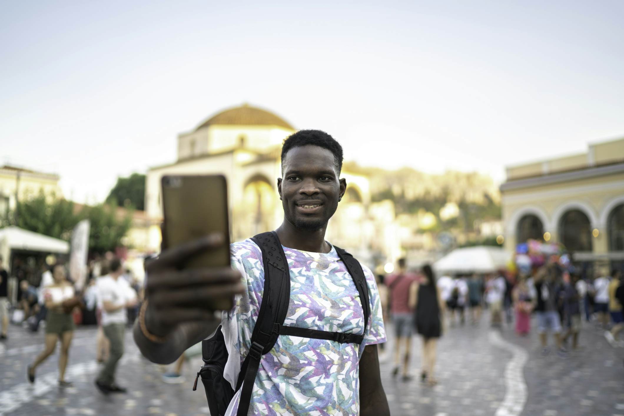 Man taking a selfie or filming in the middle of a square in the city
1166838437