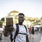 Man taking a selfie or filming in the middle of a square in the city
1166838437