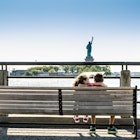 Two kids looking at Statue of Liberty from the Liberty State Park in Jersey city during summer day
1170418866