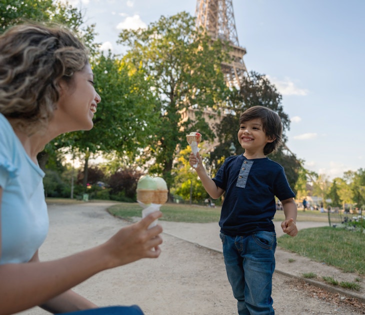 Happy mother and son eating an ice cream outdoors near the Eiffel Tower in Paris - lifestyle concepts
1182973478