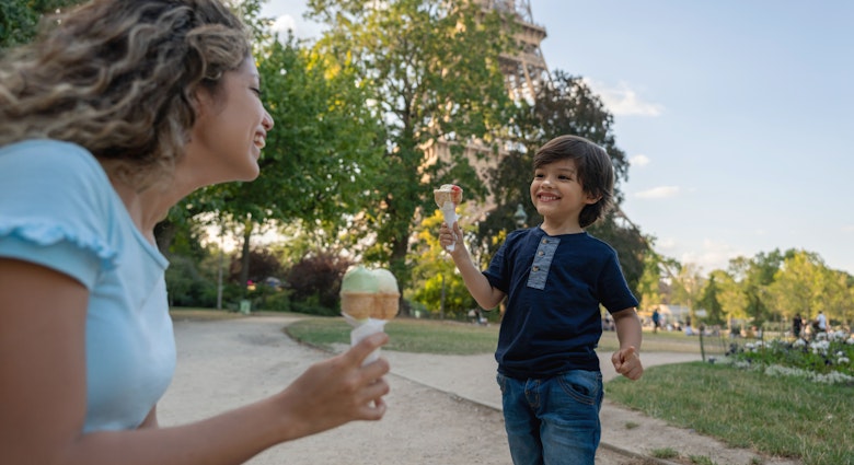 Happy mother and son eating an ice cream outdoors near the Eiffel Tower in Paris - lifestyle concepts
1182973478