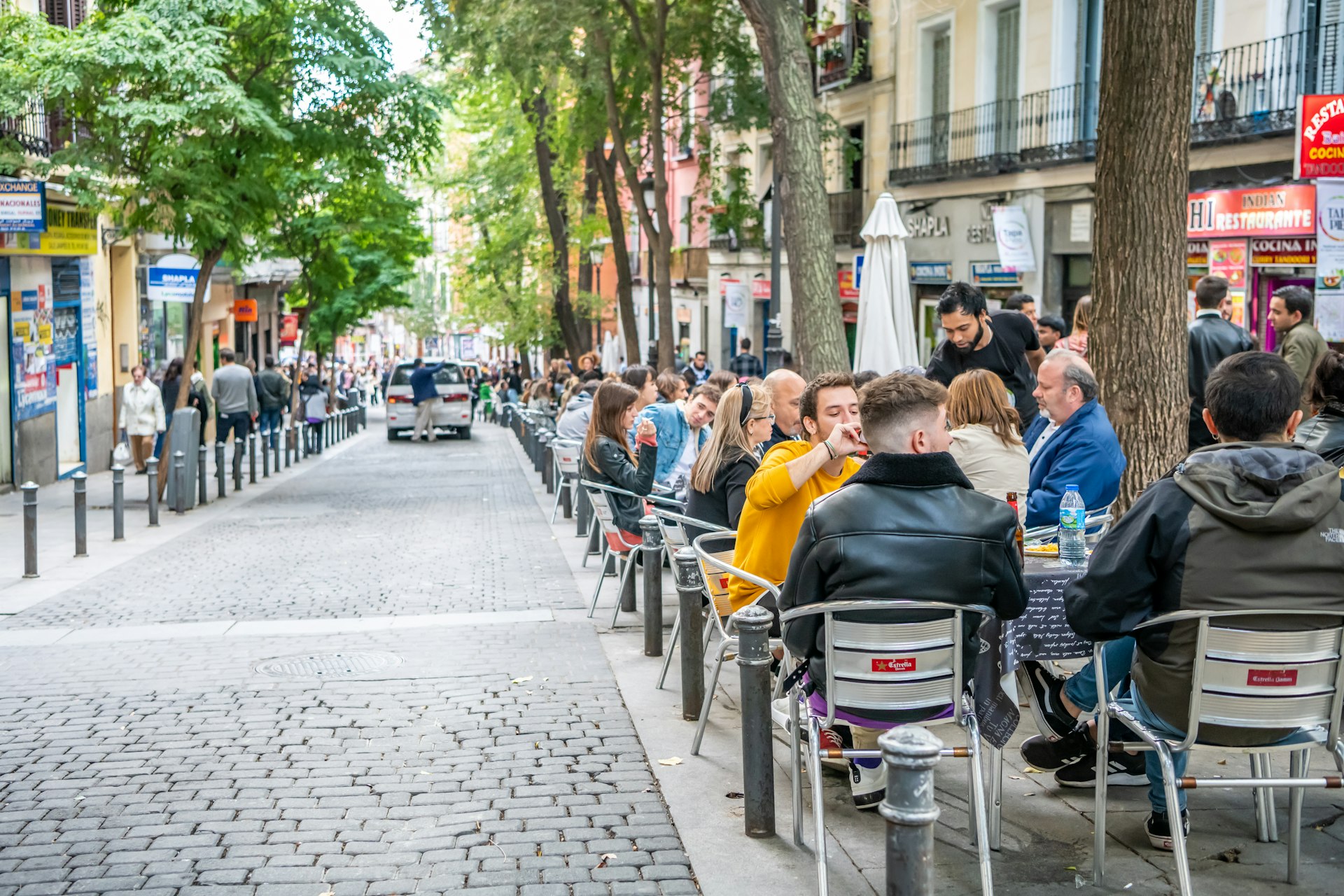 People dine out on the terrace in the popular Lavapiés neighborhood in central Madrid.