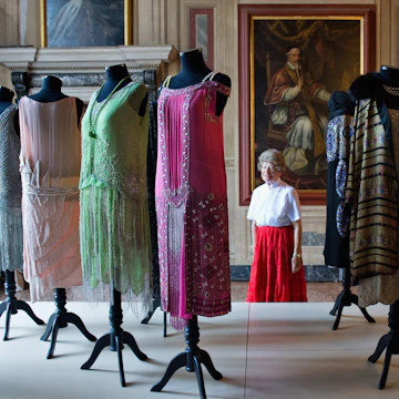 VENICE, ITALY - SEPTEMBER 16: A woman admires some dresses belonging to the collection of Alexander Vassiliev during the press preview of "Elegance in Exhile" at Palazzo Mocenigo on September 16, 2011 in Venice, Italy. "L'Eleganza in Esilio" tells the story of the cultural atmosphere and ambiance of the Russian elite at the beginning of 1900 and the international prestige of Djagilev's famous Russian Ballets. (Photo by Marco Secchi/Getty Images)
125205363
Fashion, Human Interest