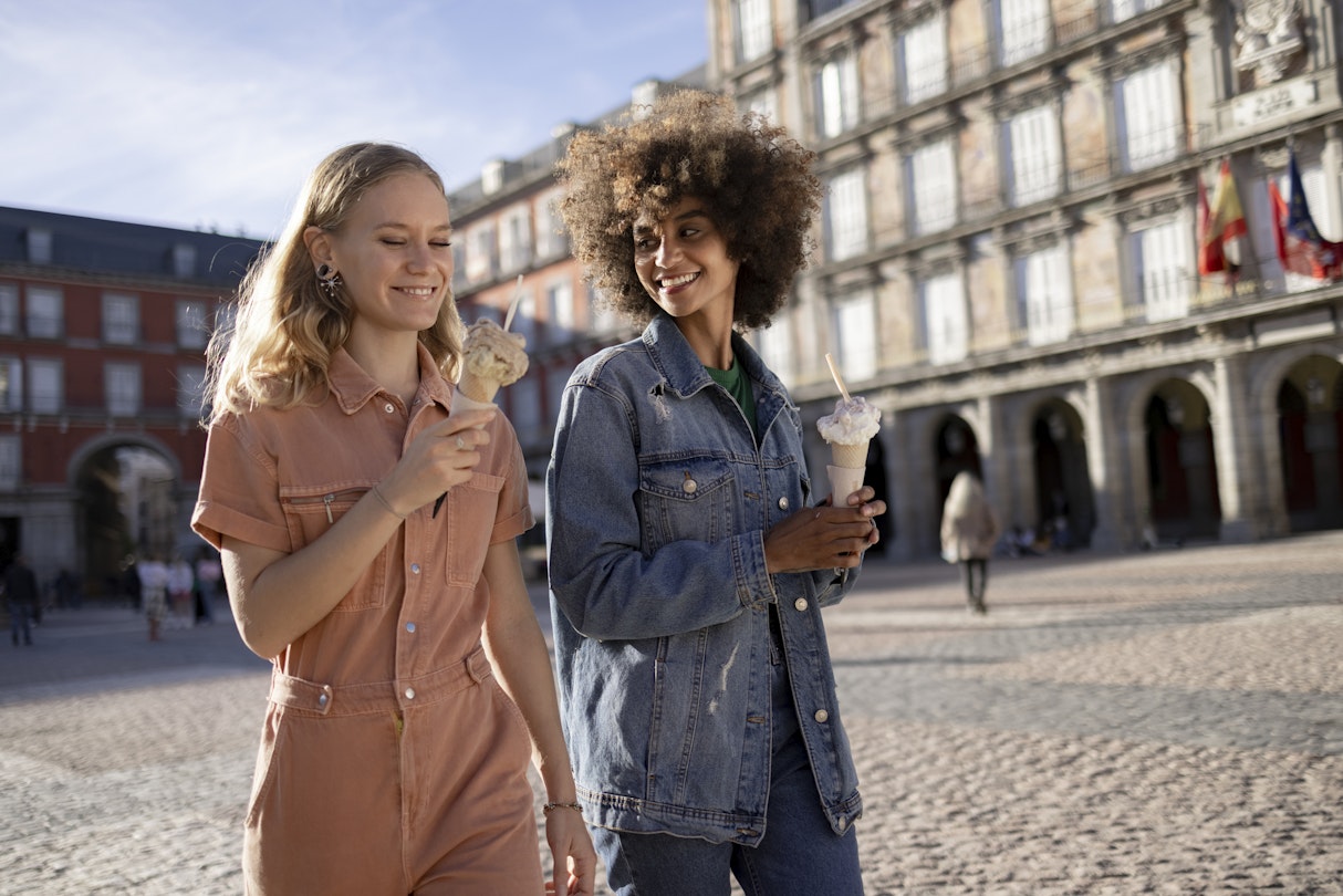 Small diverse group of female friends walking around the city of Madrid, bonding and having fun together and enjoying the ice cream
1350455026