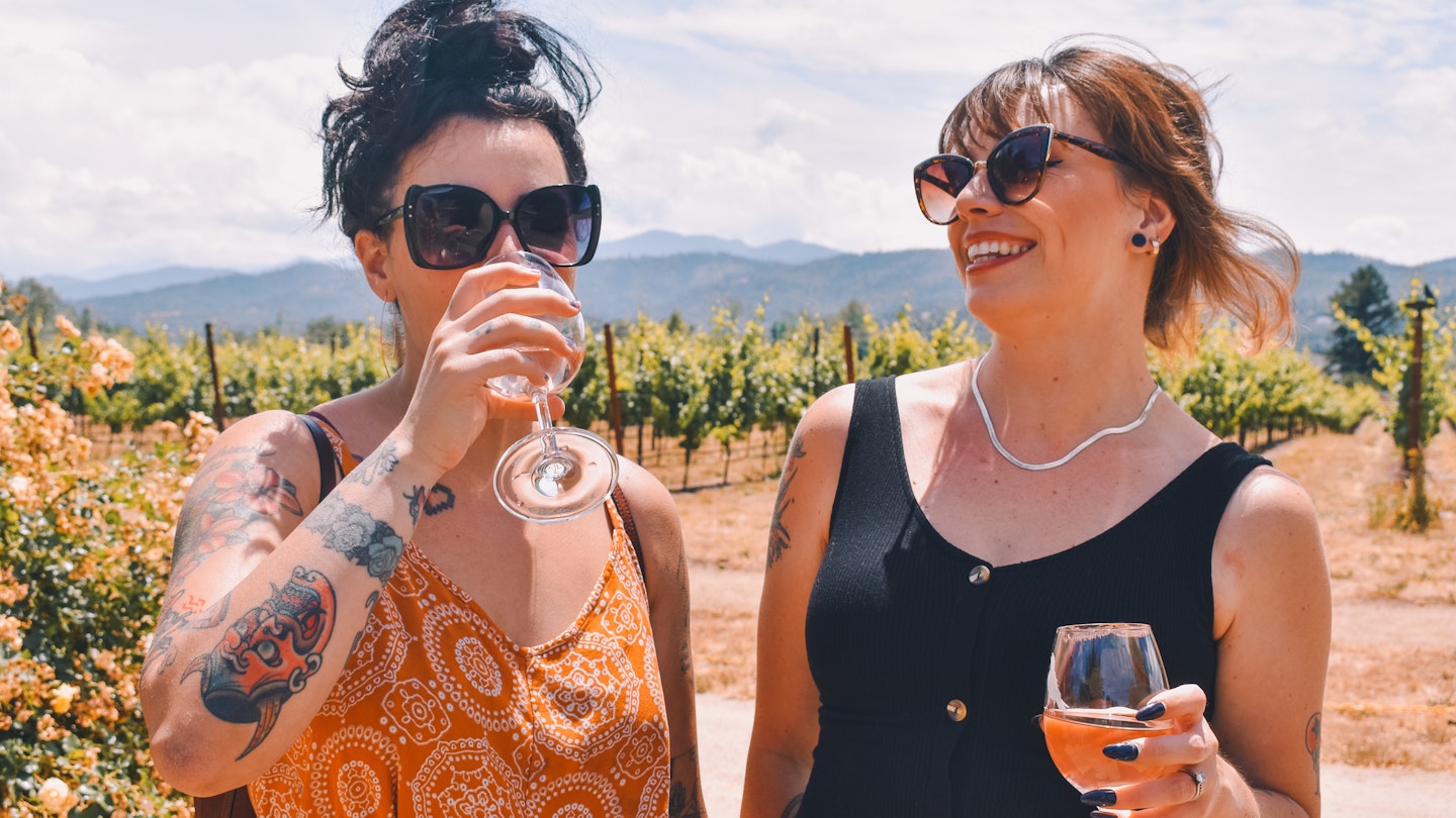 Best friends on vacation at oregon winery
1487569796
Two women drinking wine in the sunshine in a vineyard
