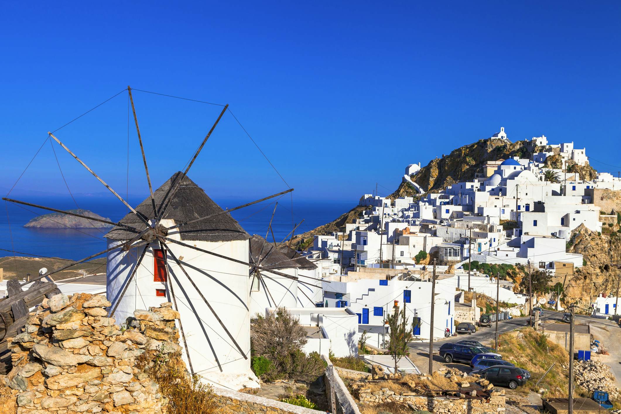 A windmill at the top of the whitewashed Hora village in Serifos, Greece