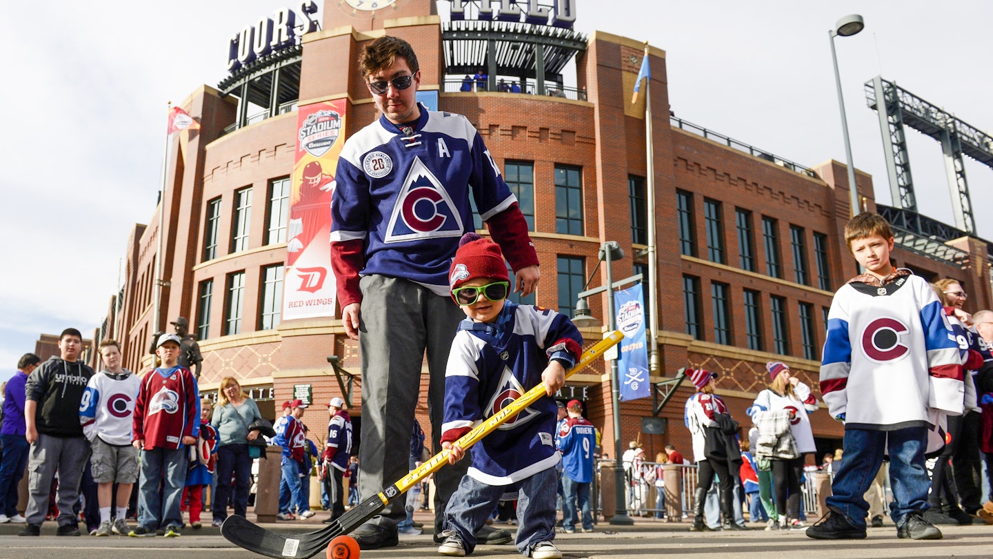DENVER, CO - February 27: Theodore Jones, 3, tests his hockey skills under the watchful eye of his father Matt Jones out in front of Coors Field before the NHL Stadium Series game featuring the Colorado Avalanche and the Detroit Redwings February 27, 2016. (Photo by Andy Cross/The Denver Post via Getty Images)
512719700
Matt Jones; Theodore Jones