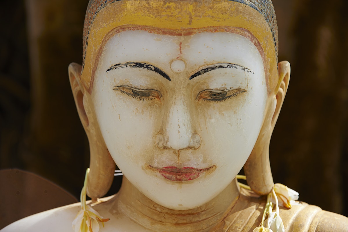 Marble Buddha at Paya Shwekyimyint temple, Mandalay, Myanmar.