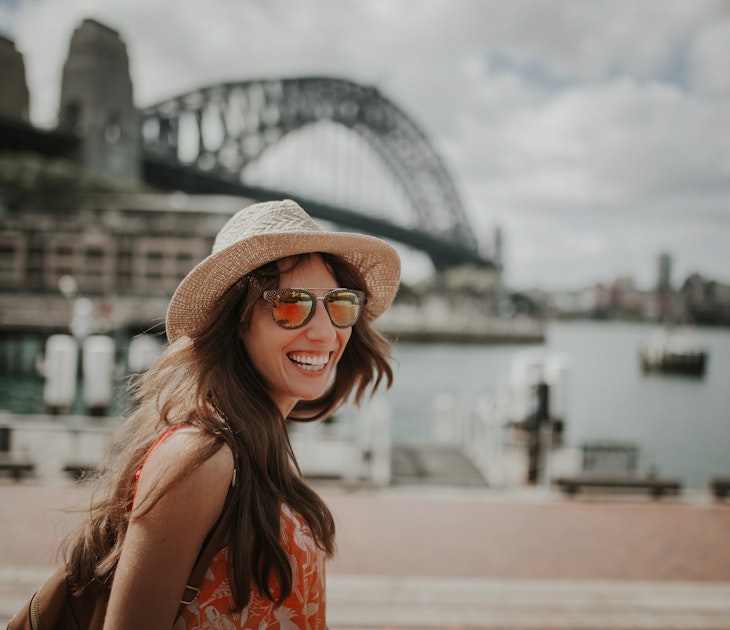 Smiling girl in hat and sunglasses posing in Sydney Harbour
667360864
Happy smiling woman exploring Sydney, with Harbour Bridge in the background
