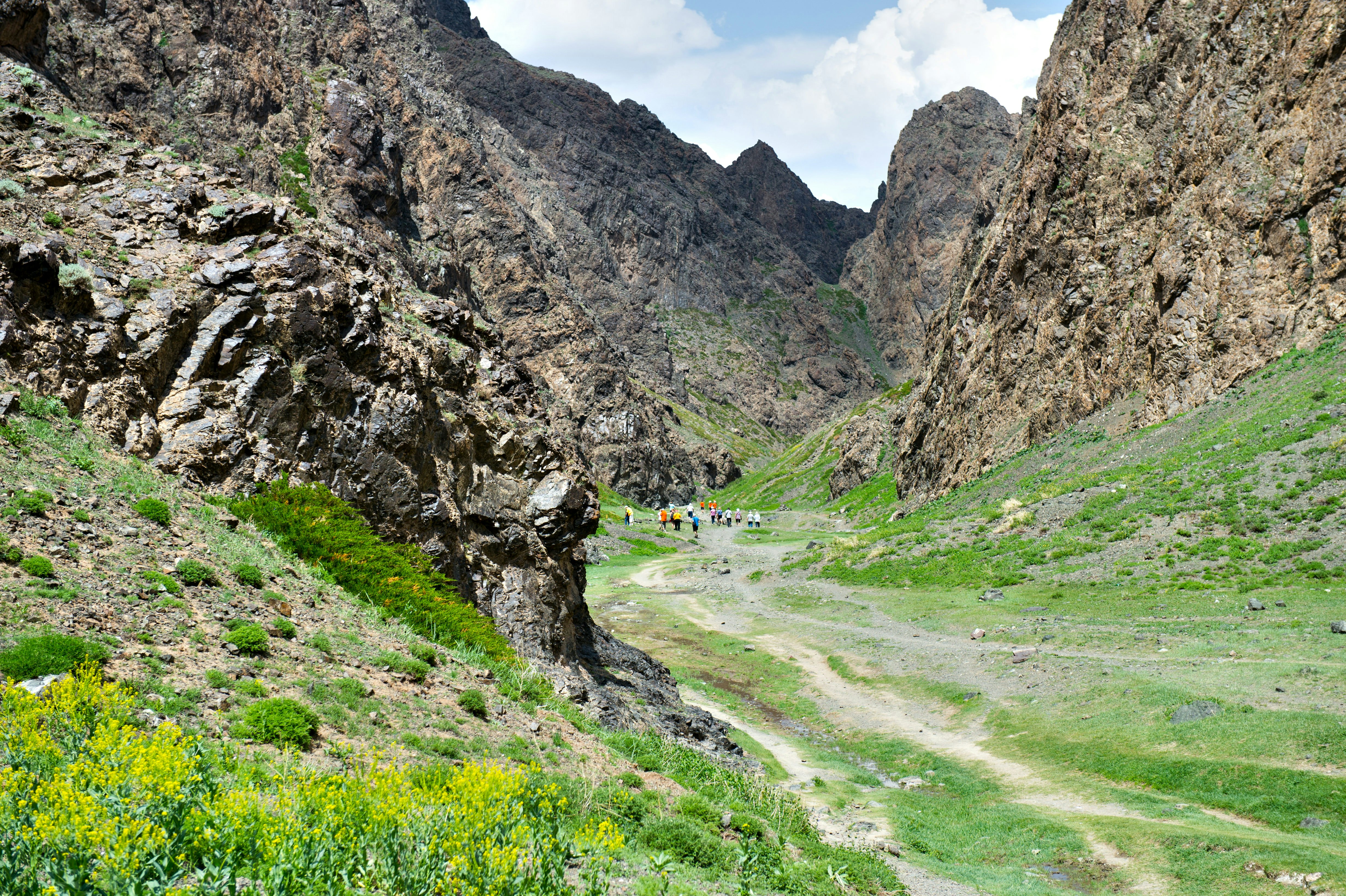 523754636
Beauty In Nature; Butte - Rocky Outcrop; Central Asia; Central Asian Ethnicity; Color Image; Day; Extreme Terrain; Famous Place; Footpath; Gobi Gurvansaikhan National Park; Grass; Gurvan Saikhan Mountains; Horizontal; Idyllic; Incidental People; Independent Mongolia; Landscape; Large Group Of People; Leaving; Mongolian Culture; Mongolian Ethnicity; Mountain; Natural Pattern; Nature; Nature Reserve; Non-Urban Scene; Outdoor Pursuit; Outdoors; People; Photography; Photography Themes; Rock - Object; Rocky Mountains; Scenics - Nature; Silence; Sunlight; Tourism; Tourist; Tranquil Scene; Tranquility; Travel; Travel Destinations; Valley; Walking; Yolyn Am;
Yolyn Am valley is located at Gurvan Saikhan Mountains of southern Mongolia.