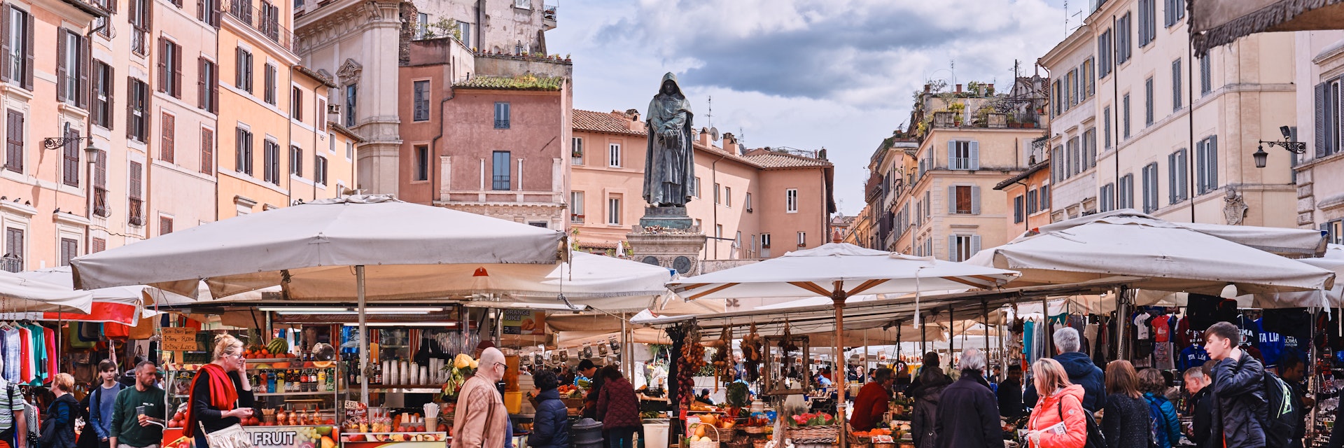 March 8, 2018: Traditional outdoor food market of Campo de Fiori (fields of flower), with the statue of Giordano Bruno in the background.
959994236
People Built Structure Food City History Architecture Nature Vacations Square Horizontal Three Quarter Length Outdoors Europe Tourist Monument Roman Italy Statue City Street Street Market - Retail Space Ancient Famous Place Rome - Italy Vegetable Fruit Flower Sky Agricultural Field Beauty Medium Group Of People Photography Tourism Travel Capital Cities Fiori Giordano Tradition