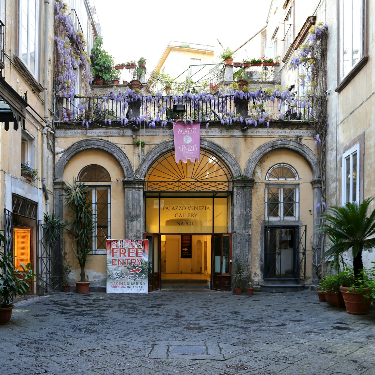 The Palazzo Venezia's history dates back to the 15th century.

IMAGE SOURCE: https://commons.wikimedia.org/wiki/File:Napoli,_palazzo_venezia,_cortile_01.jpg