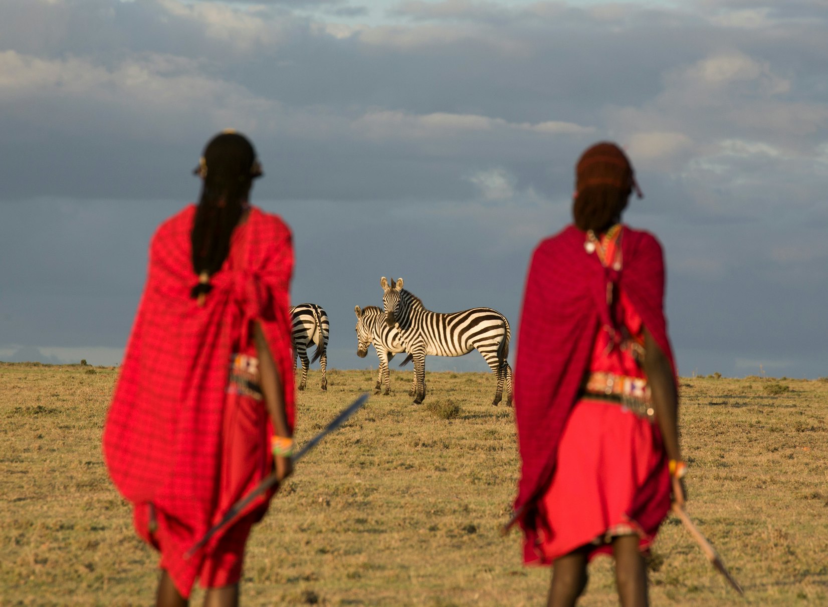Maasai tribesmen in the Maasai Mara National Park. Kenya. Africa.