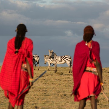 Maasai tribesmen in the Maasai Mara National Park. Kenya. Africa.