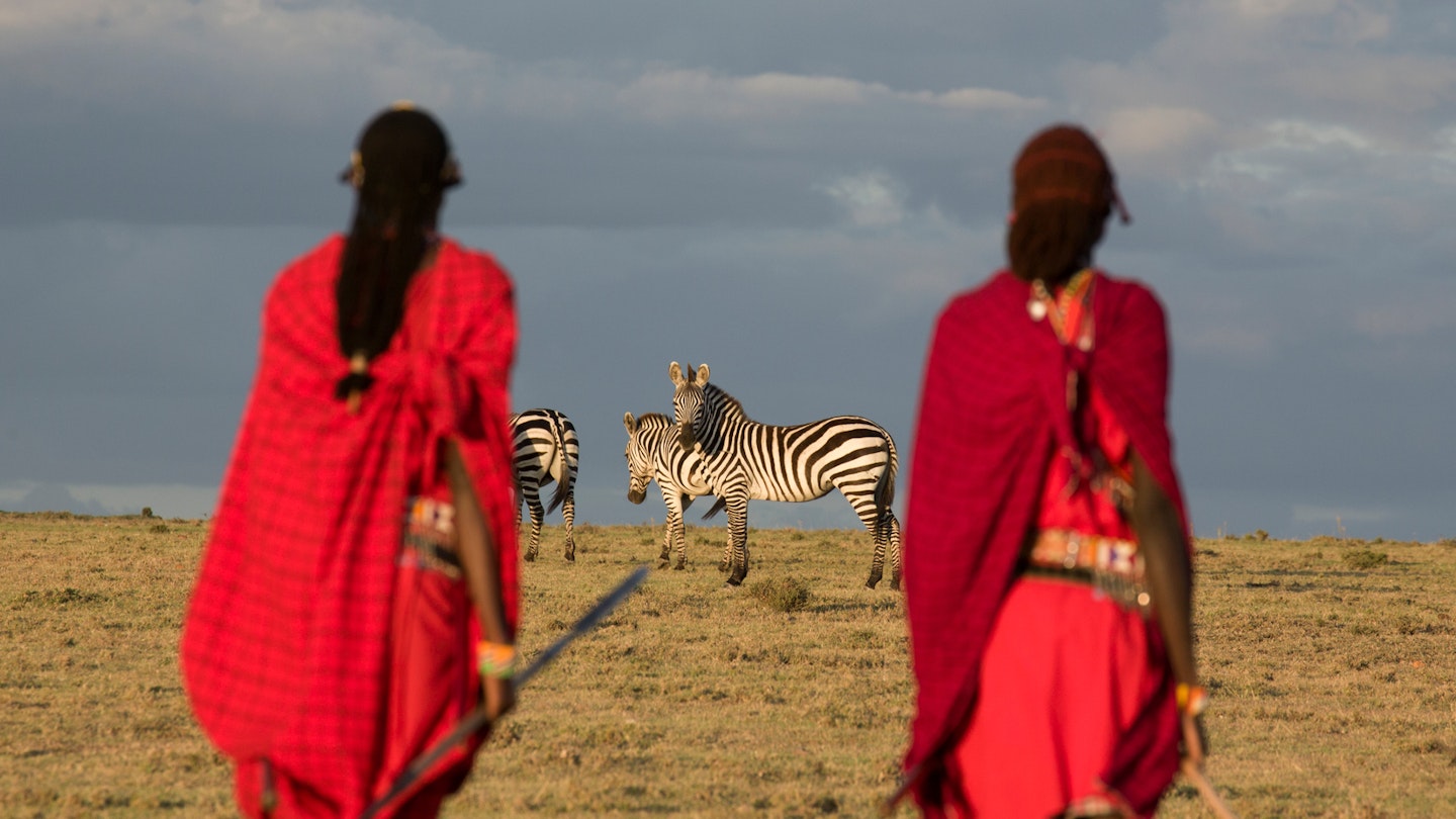 Maasai tribesmen in the Maasai Mara National Park. Kenya. Africa.