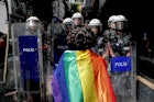 TOPSHOT - A participant faces riot policemen wearing a rainbow flag during a Pride march in Istanbul, on June 26, 2022. - Turkish police forcibly intervened in a Pride march in Istanbul, detaining dozens of demonstrators and an AFP photographer, AFP journalists on the ground said. The governor's office had banned the march around Taksim Square in the heart of Istanbul but protesters gathered nearby under heavy police presence earlier than scheduled. (Photo by KEMAL ASLAN / AFP) (Photo by KEMAL ASLAN/AFP via Getty Images)
1241549679
homosexuality, demonstration, politics, gender, Horizontal