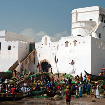 Fishing boats and Cape Coast castle