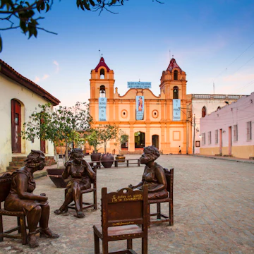 Cuba, Camaguey, Camaguey Province, Plaza Del Carmen, Iglesia de Nuestra Senora del Carmen and Unique life-sized sculptures of camagueyanos going about their daily life
bronze sculpture, christianity, statue, beauty, road, historic district, public square, church, dwelling, bell tower, architecture, dawn, Cuban culture, building, history, everyday scene, nobody, cobblestone, Camaguey, quaint, restored, charming, historic building, place of worship, religious building, sculptural, caribbean island, colonial, grilles, old house, cobbles, caribbean, bronze statue, historic centre, cobbled street, life-size, life-sized, unique, life size, colourful house, window grilles