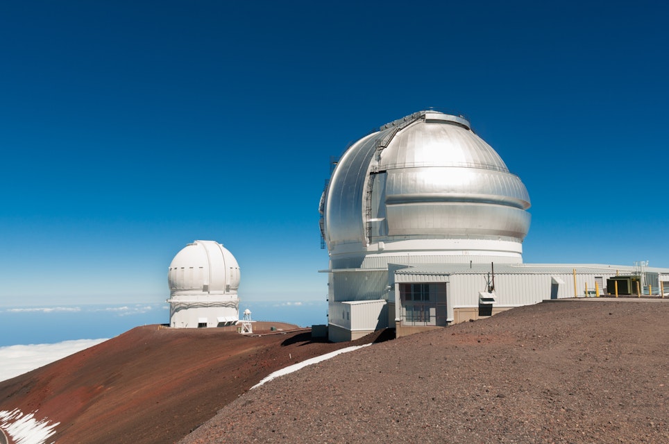 Gemini North Observatory on top of Mauna Kea mountain peak on Big Island of Hawaii, United States with deep blue sky and volcanic landscape.
1327459248