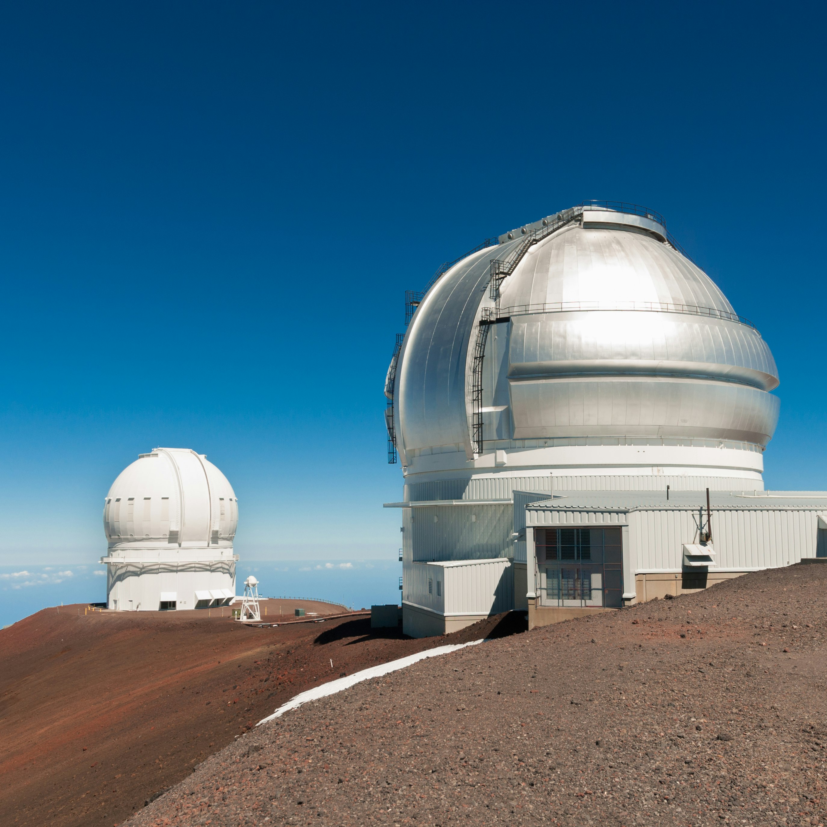 Gemini North Observatory on top of Mauna Kea mountain peak on Big Island of Hawaii, United States with deep blue sky and volcanic landscape.
1327459248