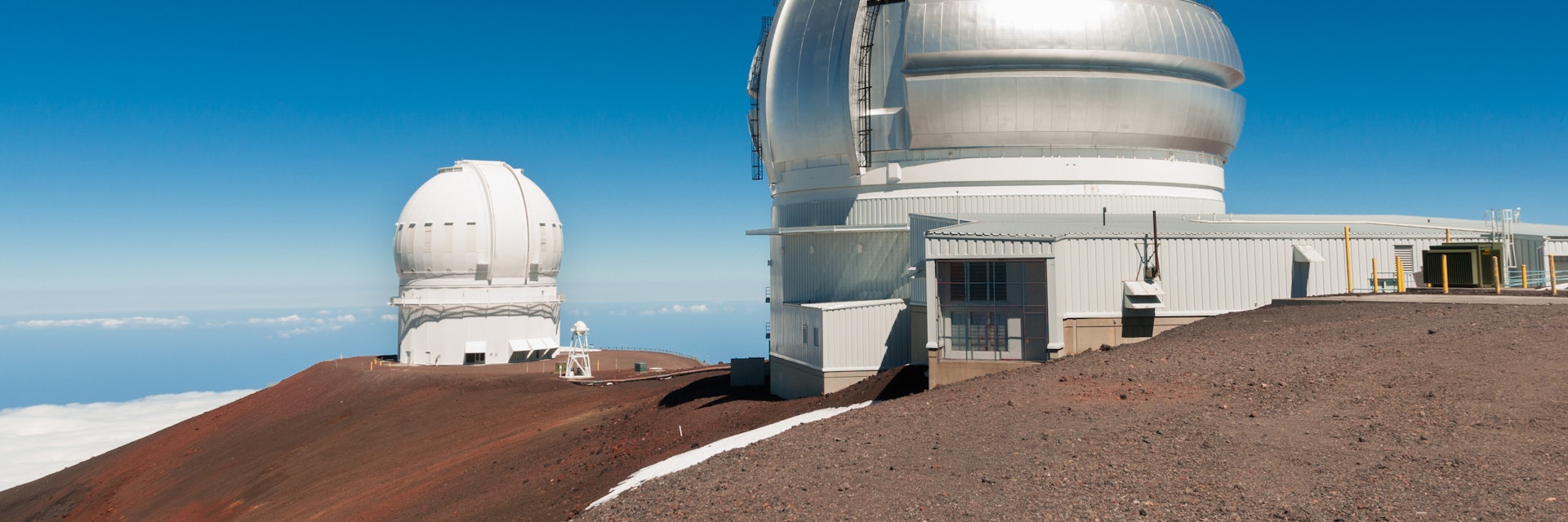 Gemini North Observatory on top of Mauna Kea mountain peak on Big Island of Hawaii, United States with deep blue sky and volcanic landscape.
1327459248