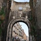 1306068077
Naples, Campania, Italy - February 26, 2020: Ancient city gate built in the 15th century
Napoli, Campania, Italia – 26 febbraio 2020: Antica porta della città edificata nel XV secolo