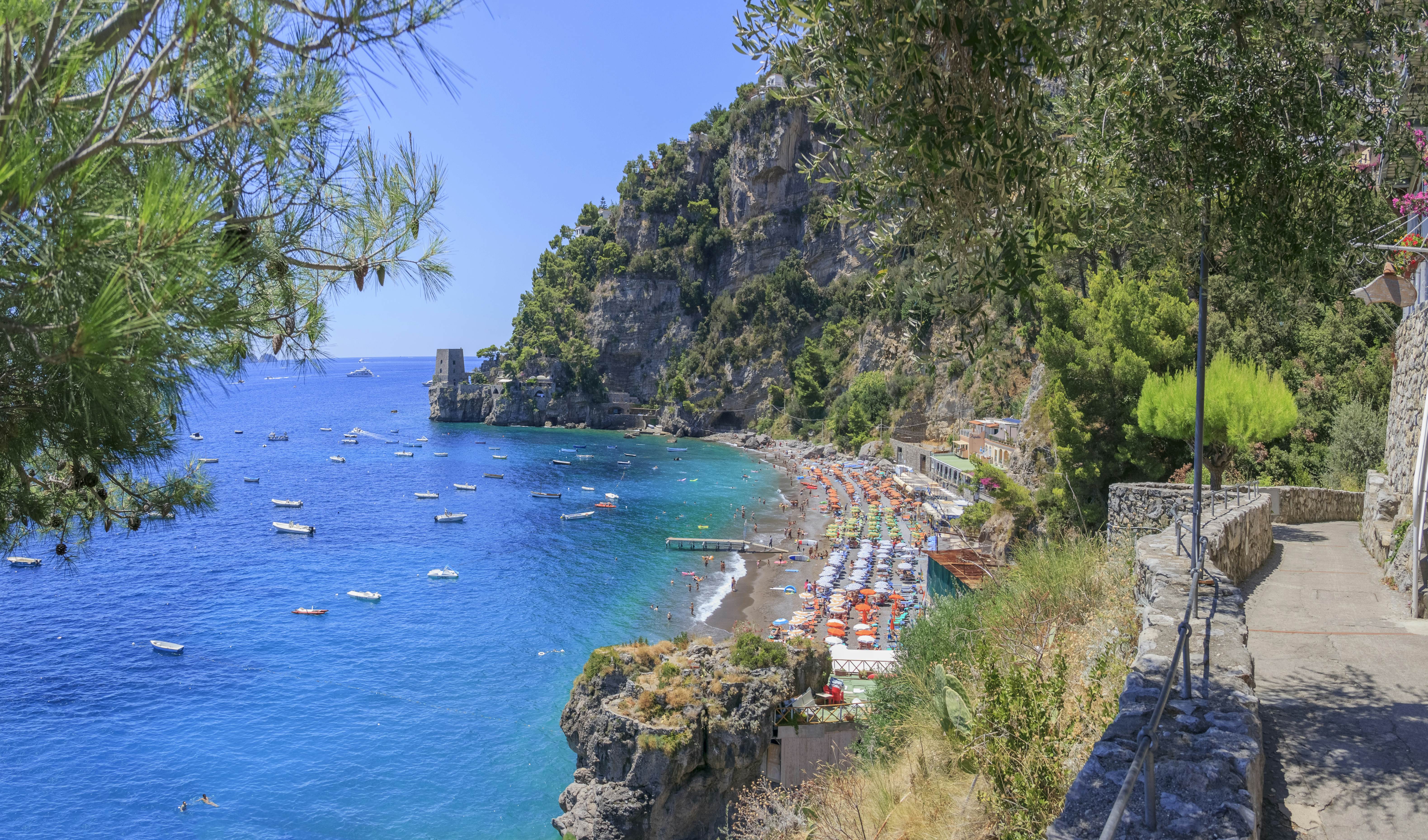 A pathway leads over to the Fornillo Beach, a more peaceful place to lay out your beach blanket and enjoy the surf and sun. You can also take a water taxi to one of the many coves and sandy spots that dot the cliffs that are reachable only by boat.Positano is a seductive place. Terraces shore up the buildings and almost every turn offers a visual bounty to enjoy. The most prevalent point of references is the colorful tiled dome of the Church of Santa Maria Assunta, in the smack-middle of town. Everything else tumbles down toward the water from here. The beach at the marina is known as Spiaggia Grande (big beach) because it is one of the Amalfi Coast's largest. This is the central seafront for the town and there are several excellent seafood restaurants just above the beach.
1332917250
