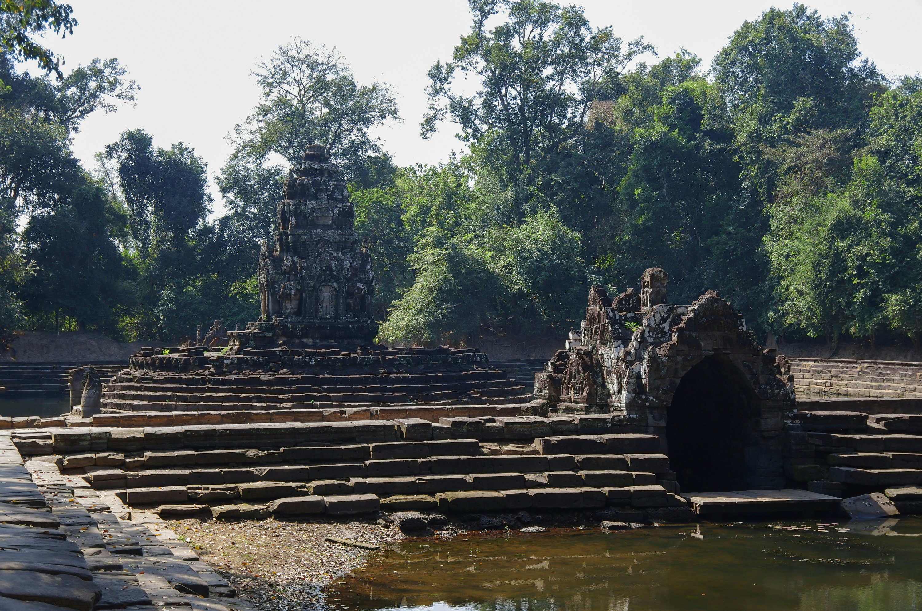 View of the island temple Preah Neak Poan at Angkor on Cambodia
1337694549
aec, antiquated, archaic, asean, asian, belief, culture, doctrine, editorial, faith, hindu, historic, jungle, lagune, landmark, mysterious, naka, primitive, reap, ruin, serpent, siem, stone, tank, temple, wood