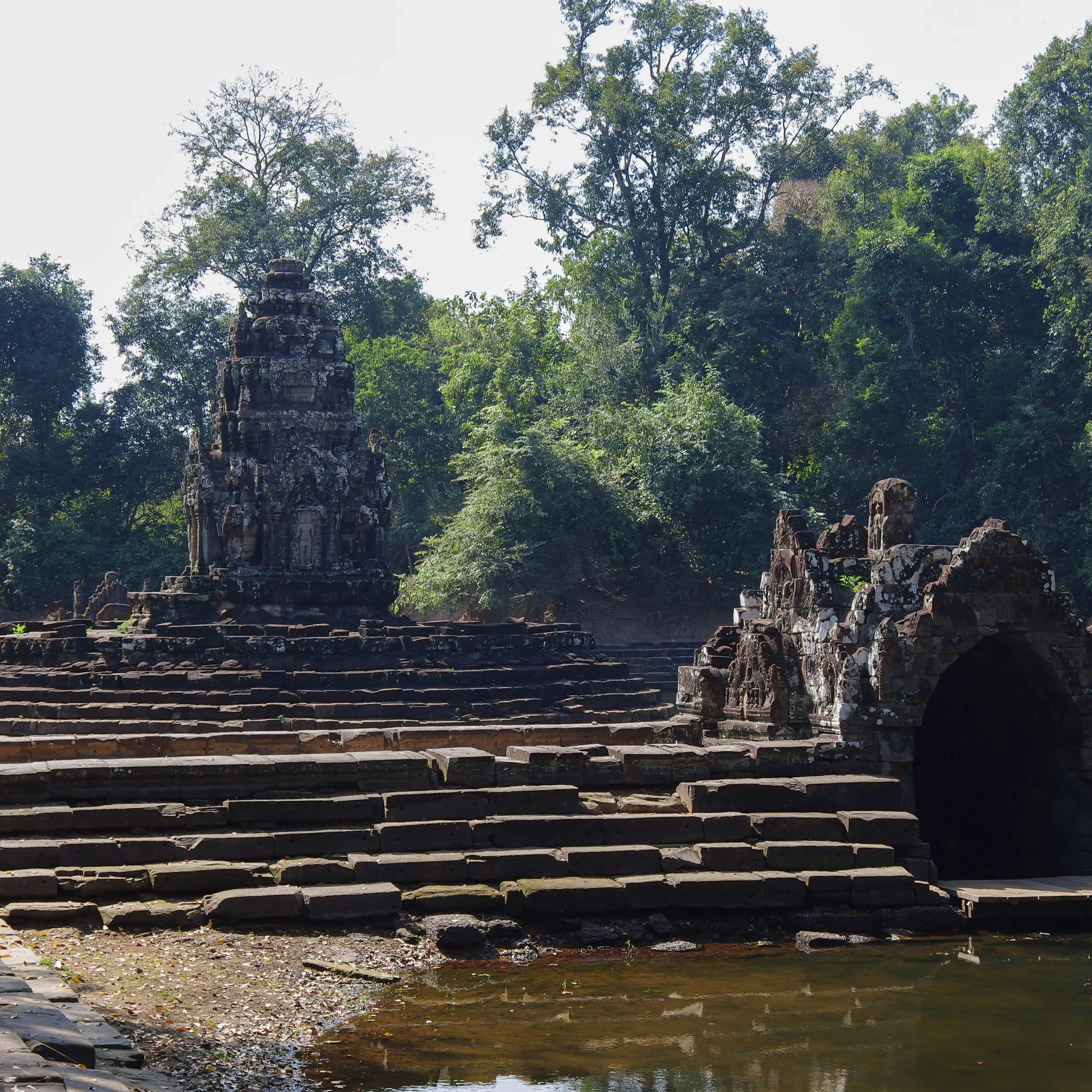 View of the island temple Preah Neak Poan at Angkor on Cambodia
1337694549
aec, antiquated, archaic, asean, asian, belief, culture, doctrine, editorial, faith, hindu, historic, jungle, lagune, landmark, mysterious, naka, primitive, reap, ruin, serpent, siem, stone, tank, temple, wood