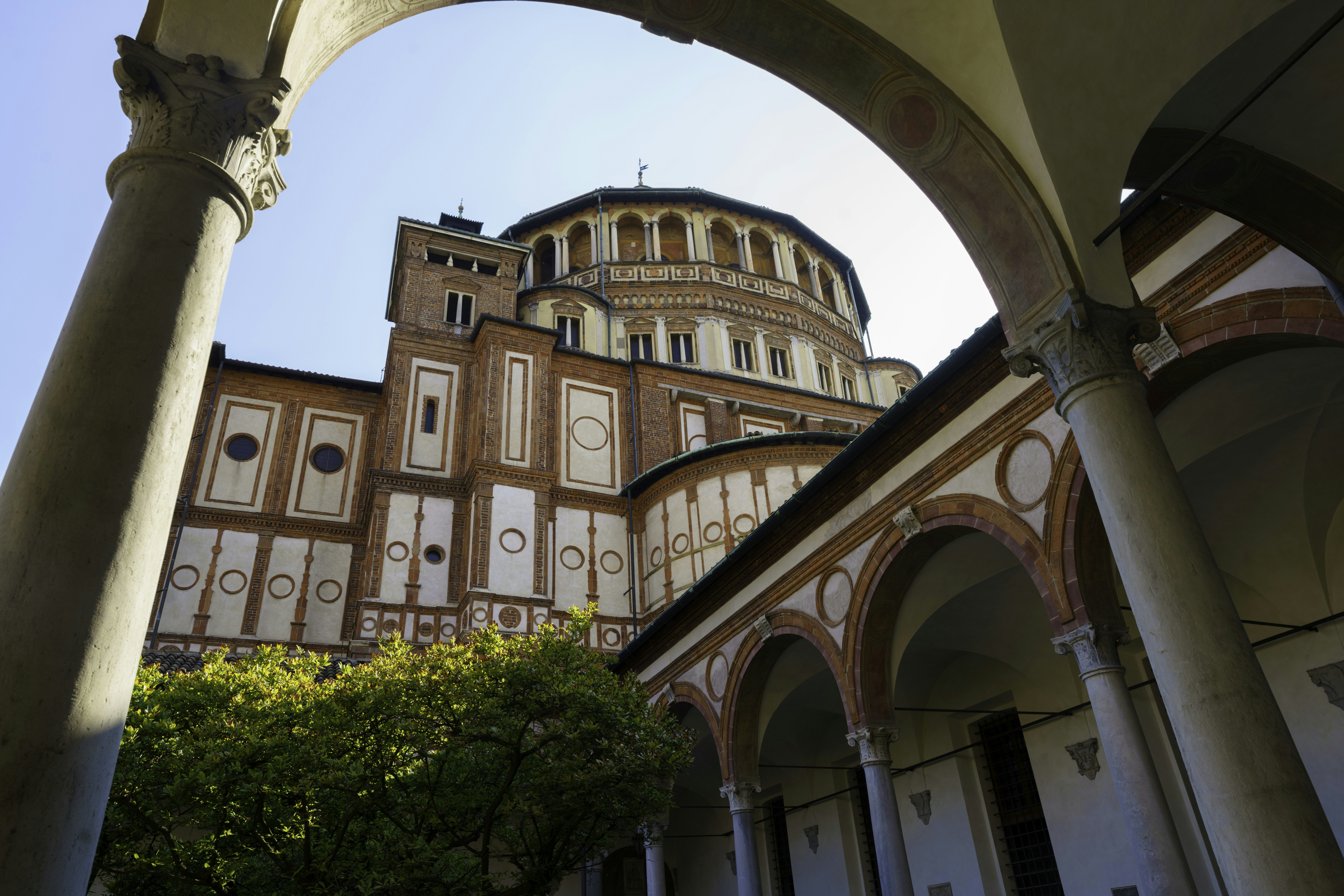 A church and its cloisters on a sunny day.