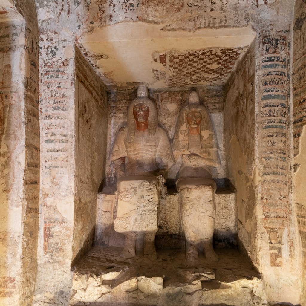 Statues of Amenemopet, the Chief Steward of Amun, and his wife in his tomb, Valley of Nobles in Thebes, Luxor, Egypt.