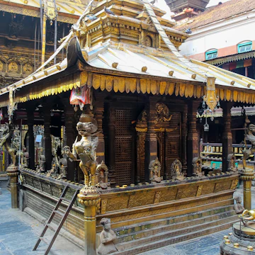 Hiranya Varna Mahavihar (The Golden Temple) buildings exterior in a sunny day in Lalitpur city, Nepal.