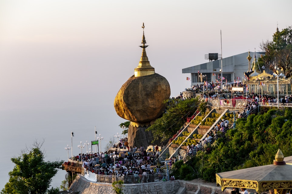 At sunset, hundreds of pilgrims crowd under the Golden Rock, Mt Kyaiktiyo, for the celebrations of the Festival of Lights.