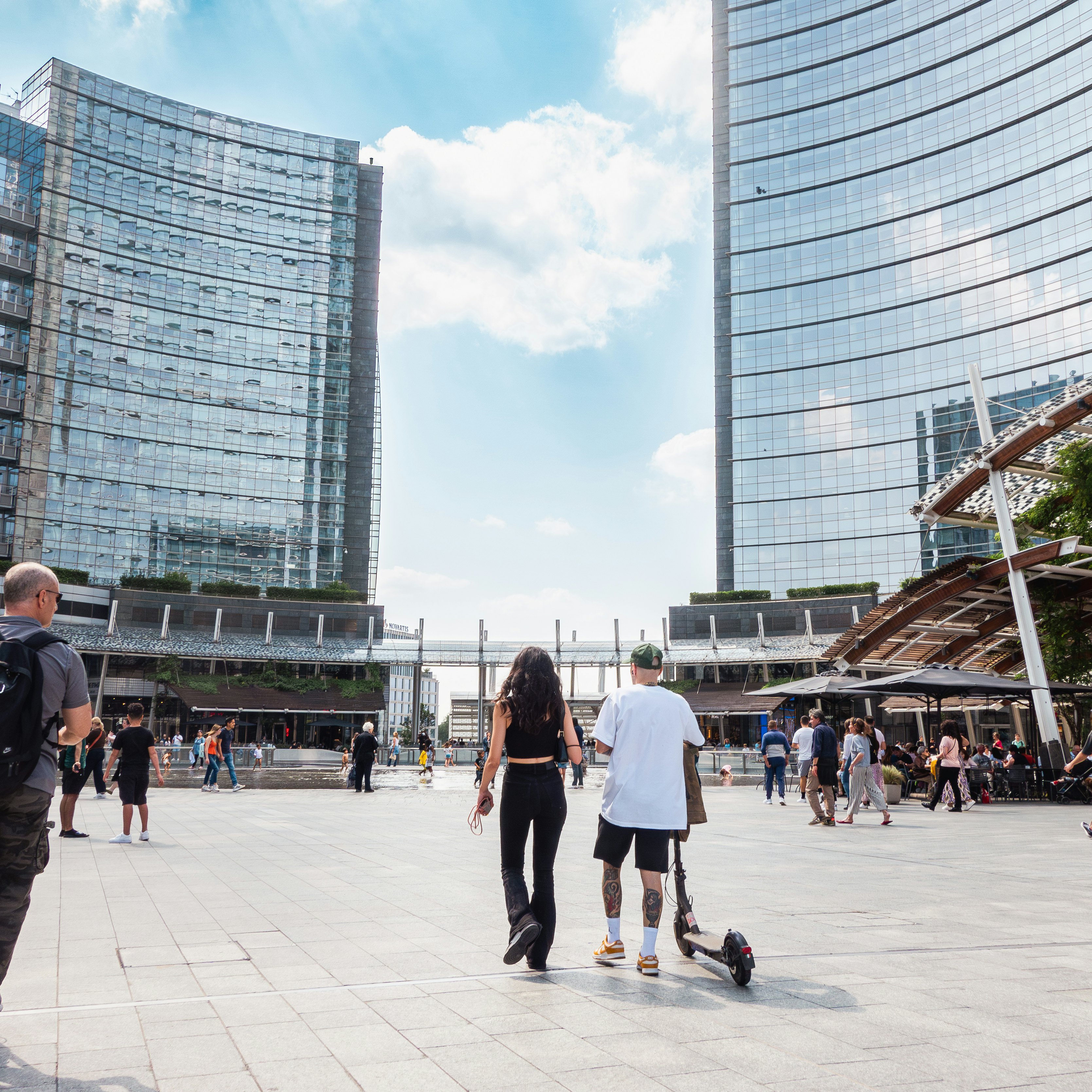 Milan, Gae Aulenti square, people on electric push scooter. Pedestrian zone in modern Milan square with glass buildings and people on electric scooters
1494064400
strolling, editorial, aulenti, beautiful, blue sky, building, center, destinations, gae, landmark, milano, tourists, urban, italian, square, porta nuova