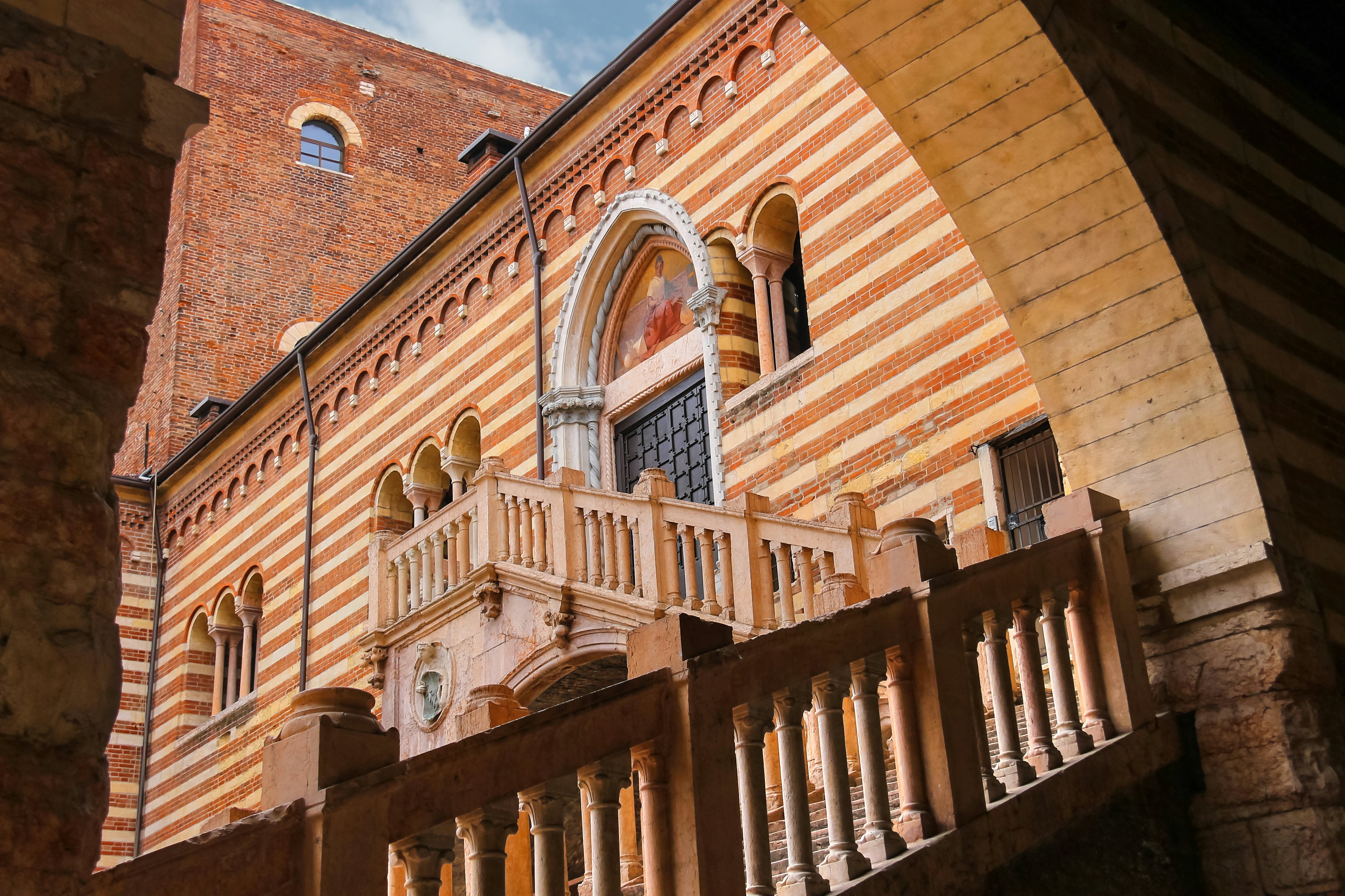 Staircase of reason in the courtyard of the Palazzo della Ragione leading to the Galleria d'Arte Moderna Achille Forti in Verona, Italy.