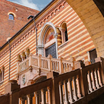 Staircase of reason in the courtyard of the Palazzo della Ragione leading to the Galleria d'Arte Moderna Achille Forti in Verona, Italy.