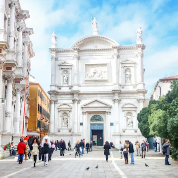 Venice, Italy - February 15th, 2014 : People walking in the square San Rocco in front of a renaissance palace called Scuola Grande di San Rocco in Venice, Italy.
534805231
Editorial, Mediterranean Countries, Travel, Tourism, Photography, Building Exterior, Cloudscape, Large Group Of People, Color Image, Walking, Renaissance, History, White, Green Color, Brown, Blue, Ancient, Old, Cultures, Architecture, Travel Destinations, Vacations, Outdoors, Horizontal, Tourist, People, Venice - Italy, Italy, Europe, Tree, Day, Cloud - Sky, Sky, Town Square, Palace, Built Structure, City, Town, Style, Mediterranean Culture, Scuola Grande Di San Rocco