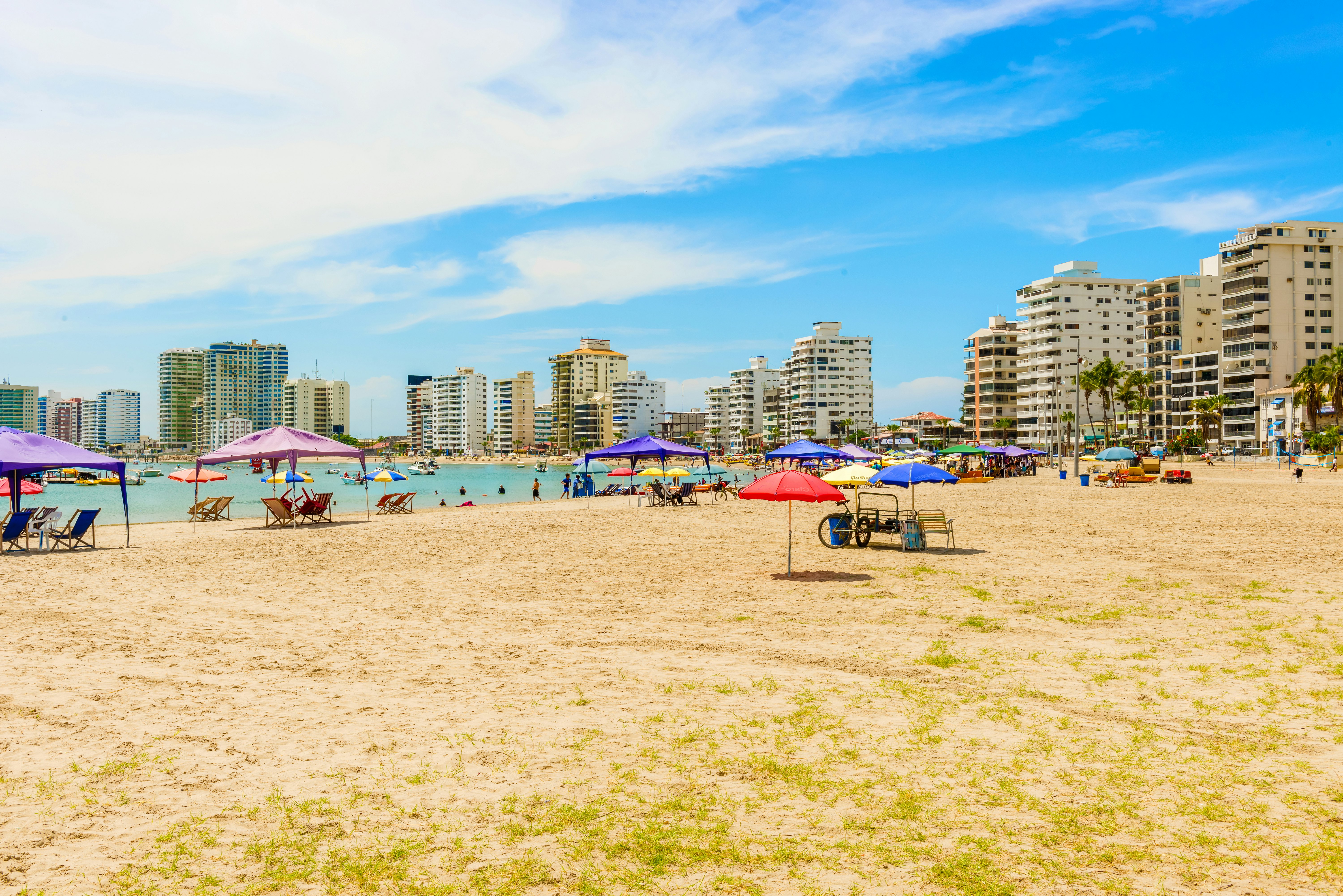 People visiting Playa de San Lorenzo in Salinas, Ecuador.