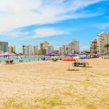 People visiting Playa de San Lorenzo in Salinas, Ecuador.