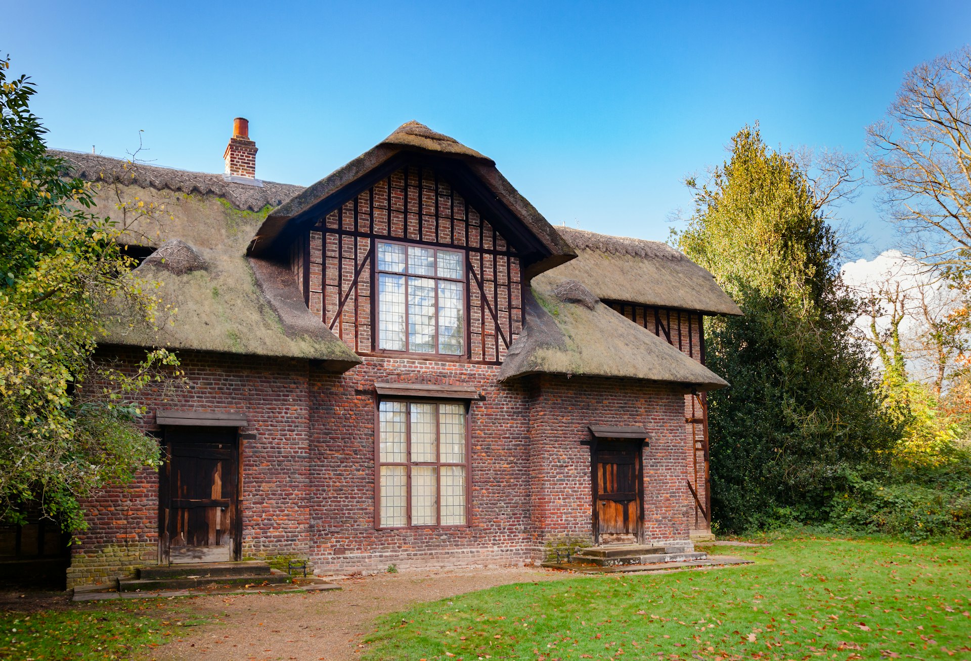 Thatched Queen Charlotte's Cottage at Kew Gardens botanical garden.